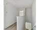Upstairs hallway with wood-look floors and access to bedrooms at 20461 Berrywood Ln, Tampa, FL 33647