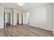 Spacious bedroom with wood-look floors and ample closet space at 20461 Berrywood Ln, Tampa, FL 33647