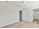Bright bedroom with wood-look floors and access to bathroom at 20461 Berrywood Ln, Tampa, FL 33647