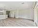Open dining area with wood-like floors and access to a patio at 20461 Berrywood Ln, Tampa, FL 33647