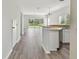 Open floor plan with kitchen, living area, and pond view at 20461 Berrywood Ln, Tampa, FL 33647