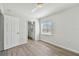 Spacious bedroom with wood-look floors and an ensuite bathroom at 20461 Berrywood Ln, Tampa, FL 33647