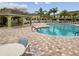 Community pool with patio area, tables, and chairs at 20461 Berrywood Ln, Tampa, FL 33647