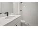 Bright bathroom features white tiled shower, modern fixtures, and sleek vanity at 11963 Richmond Trl, Parrish, FL 34219