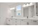 Modern bathroom with double sinks, ample counter space, and bright lighting creating a spa-like atmosphere at 11963 Richmond Trl, Parrish, FL 34219