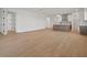 Spacious open-concept living area with wood floors at 11963 Richmond Trl, Parrish, FL 34219