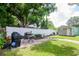 Landscaped backyard with patio, grill and shed at 9717 N Rome Ave, Tampa, FL 33612
