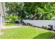 Backyard with a patio, grill area, and lush landscaping at 9717 N Rome Ave, Tampa, FL 33612