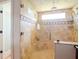 Elegant bathroom with a large walk-in shower and tile surround at 9717 N Rome Ave, Tampa, FL 33612
