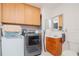 Convenient bathroom with washer and dryer in the same room at 9717 N Rome Ave, Tampa, FL 33612