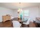 Bright dining room with a round table, chandelier, and hardwood floors at 9717 N Rome Ave, Tampa, FL 33612