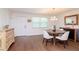 Bright dining room with a round table, chandelier, and hardwood floors at 9717 N Rome Ave, Tampa, FL 33612