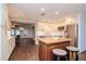 Modern kitchen with white cabinets, stainless steel appliances, and an island at 9717 N Rome Ave, Tampa, FL 33612