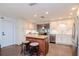 Modern kitchen with white cabinets, stainless steel appliances, and an island at 9717 N Rome Ave, Tampa, FL 33612