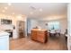 Updated kitchen, stainless steel appliances, island, and wood flooring at 9717 N Rome Ave, Tampa, FL 33612