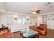 Spacious living room featuring hardwood floors, comfortable seating, and access to a patio at 9717 N Rome Ave, Tampa, FL 33612