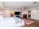 Large main bedroom with hardwood floors and a ceiling fan at 9717 N Rome Ave, Tampa, FL 33612
