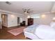 Main bedroom with hardwood floors, a ceiling fan, and access to a patio at 9717 N Rome Ave, Tampa, FL 33612