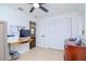 Home office with built-in shelving and hardwood flooring at 9717 N Rome Ave, Tampa, FL 33612