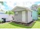 Detached storage shed offers extra space for tools and equipment at 9717 N Rome Ave, Tampa, FL 33612