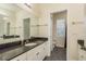 Bathroom with dark countertop, white cabinets, and shower/tub combo at 16637 Ashton Green Dr, Lutz, FL 33558