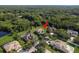 An aerial view showcasing a house nestled in a lush, wooded neighborhood at 16637 Ashton Green Dr, Lutz, FL 33558