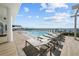 Luxury rooftop pool with ample lounge chairs and water views at 2910 W Barcelona St # 2001, Tampa, FL 33629