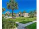 Landscaped grounds with palm trees and walkways at 19725 Gulf Blvd # 33, Indian Shores, FL 33785