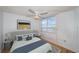 Main bedroom with water views and a ceiling fan at 632 Edgewater Dr # 437, Dunedin, FL 34698