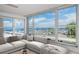 Living room with expansive windows and marina view at 632 Edgewater Dr # 437, Dunedin, FL 34698