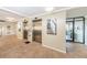 Condo lobby with elevators and artwork at 632 Edgewater Dr # 437, Dunedin, FL 34698