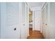 Hallway with multiple double door closets at 632 Edgewater Dr # 437, Dunedin, FL 34698