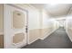 Clean and well-lit hallway with carpeted floors at 632 Edgewater Dr # 437, Dunedin, FL 34698