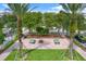 Overhead shot of a community park with ping pong tables, seating and a beautifully landscaped outdoor space at 10022 Bentley Way, Tampa, FL 33626