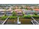 Back of house with private pool, deck, and dock, offering serene waterfront living at 1233 Acappella Ln, Apollo Beach, FL 33572