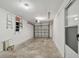 Garage featuring a work area and garage door opener at 251 Hidden Brook Dr # 102C, Palm Harbor, FL 34683
