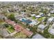 Overhead shot of a suburban area showcasing diverse homes and lush landscaping at 272 Diogenes St, Dunedin, FL 34698