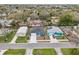 Aerial view of the home, nestled in a residential neighborhood with mature trees at 272 Diogenes St, Dunedin, FL 34698
