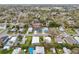 Neighborhood aerial view of the home near a baseball field and mature trees at 272 Diogenes St, Dunedin, FL 34698