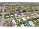 Neighborhood aerial view of the home near a baseball field and mature trees at 272 Diogenes St, Dunedin, FL 34698