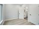 Bedroom showcasing ensuite bathroom with white painted door and modern gray flooring at 272 Diogenes St, Dunedin, FL 34698