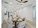 Open floor plan dining room featuring modern ceiling fan and view of the kitchen at 272 Diogenes St, Dunedin, FL 34698