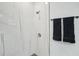 Elegant shower featuring white tile with gray veining and modern fixtures at 272 Diogenes St, Dunedin, FL 34698