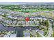 Aerial view of waterfront home with private dock and boat slips, situated in a desirable community at 528 Islebay Dr, Apollo Beach, FL 33572