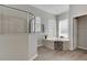 Spa-like bathroom with soaking tub, walk-in shower, and double vanity at 528 Islebay Dr, Apollo Beach, FL 33572