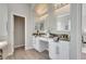 Double vanity bathroom with granite countertops at 528 Islebay Dr, Apollo Beach, FL 33572