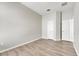 Light and airy bedroom with wood-look floors and ample closet space at 528 Islebay Dr, Apollo Beach, FL 33572