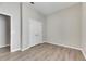 Spacious bedroom with double doors and wood-look floors at 528 Islebay Dr, Apollo Beach, FL 33572