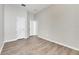 Simple bedroom with wood-look floors and neutral wall tones at 528 Islebay Dr, Apollo Beach, FL 33572