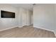 Bedroom with wood-look floors and mounted TV at 528 Islebay Dr, Apollo Beach, FL 33572